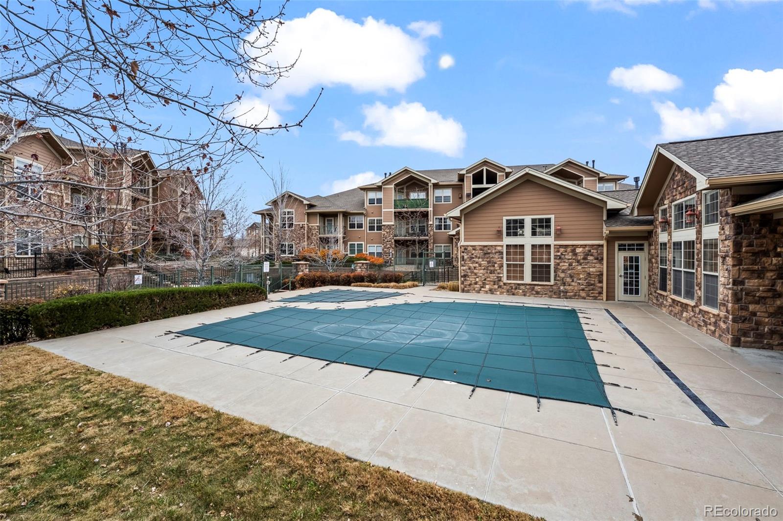 10787 Twenty Mile Road, Unit 301 Parker, CO 80134 - Photo 30 of 31 a view of a house with a yard