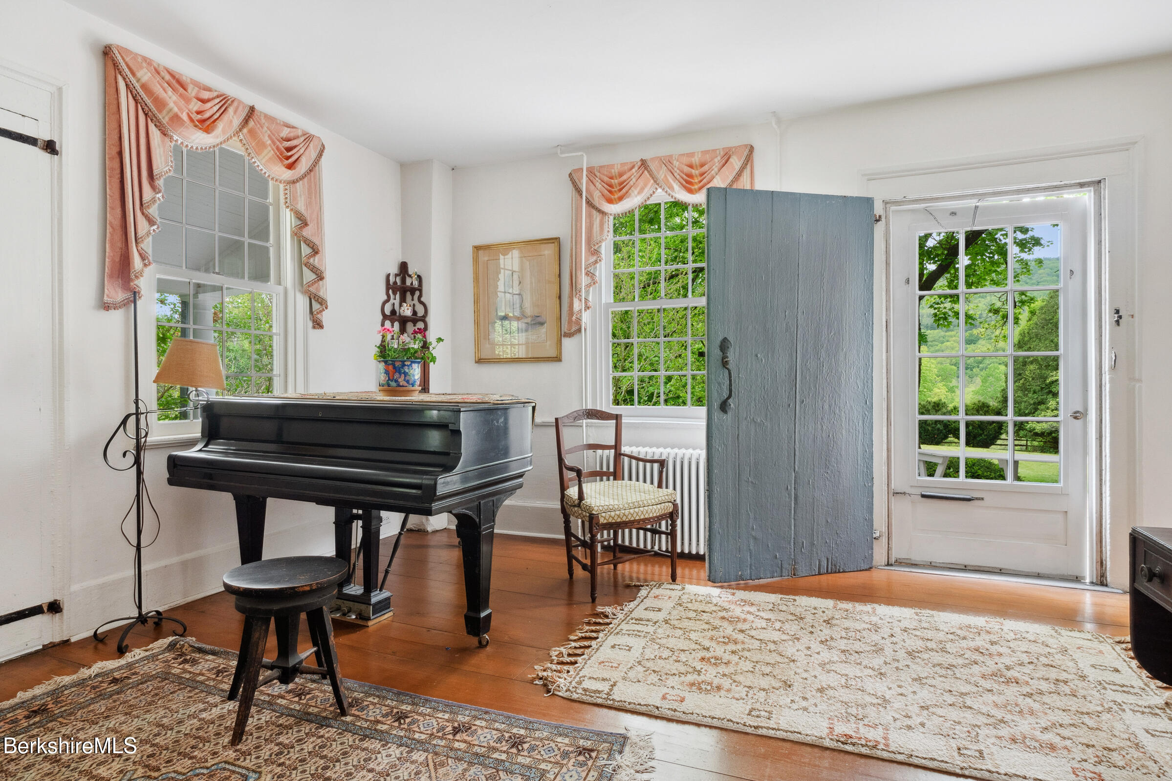 28 Main Road Tyringham, MA 01264 - Photo 18 of 79 living room door to side porch