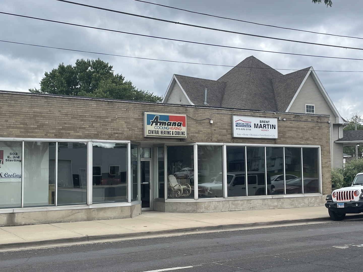 503 East 3rd Street Sterling, IL 61081 - Photo 1 of 10 a view of a building with a window and a ceiling fan