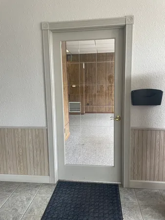 an empty room with closet and a bathroom