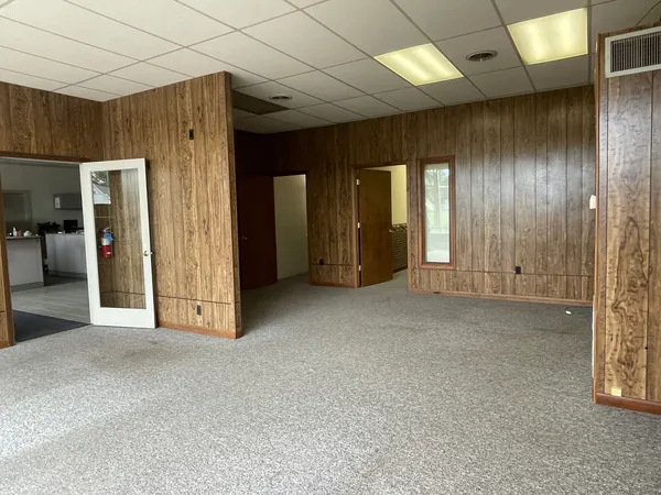 an empty room with a wooden walls