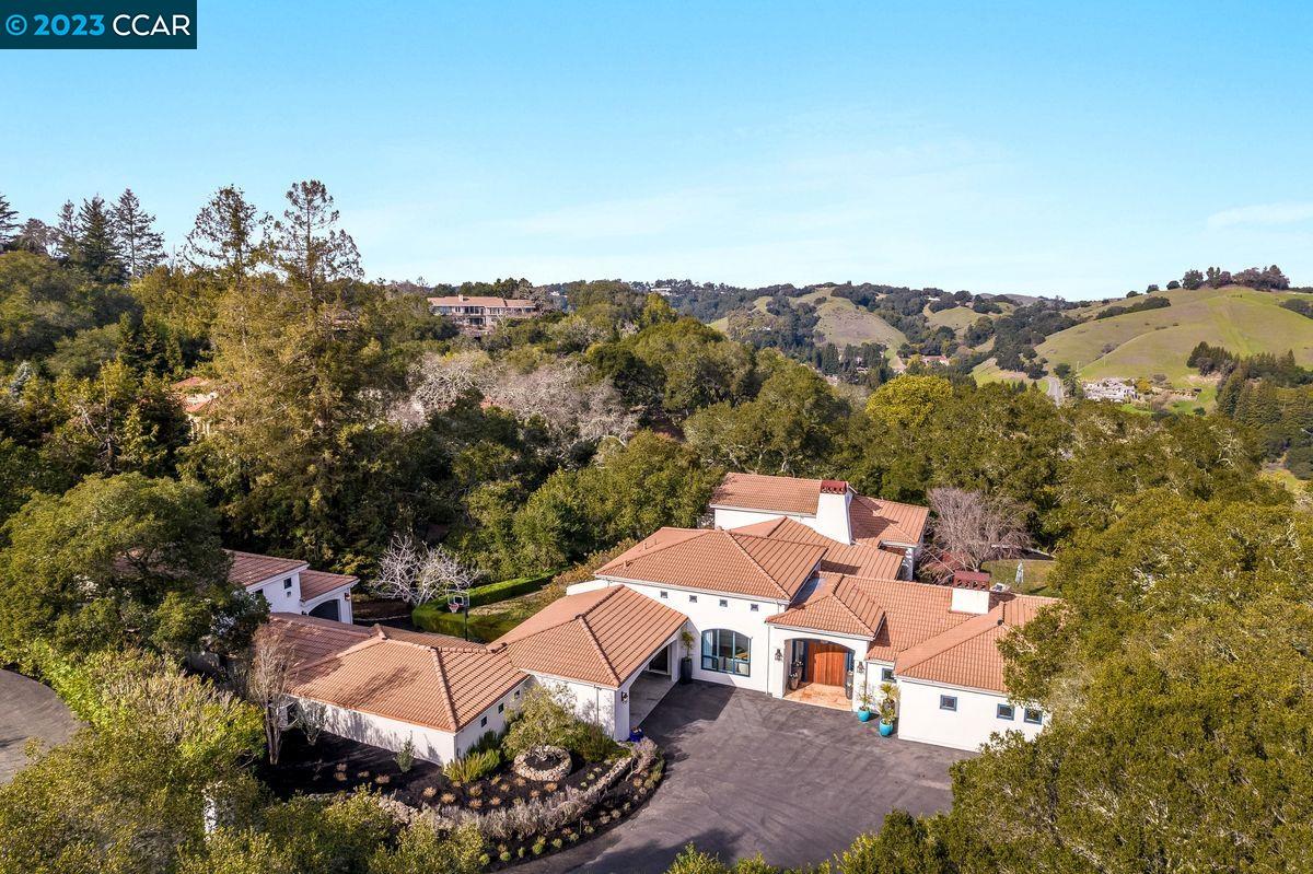 4174 Canyon Road Lafayette, CA 94549 - Photo 1 of 1 an aerial view of a house with a mountain view