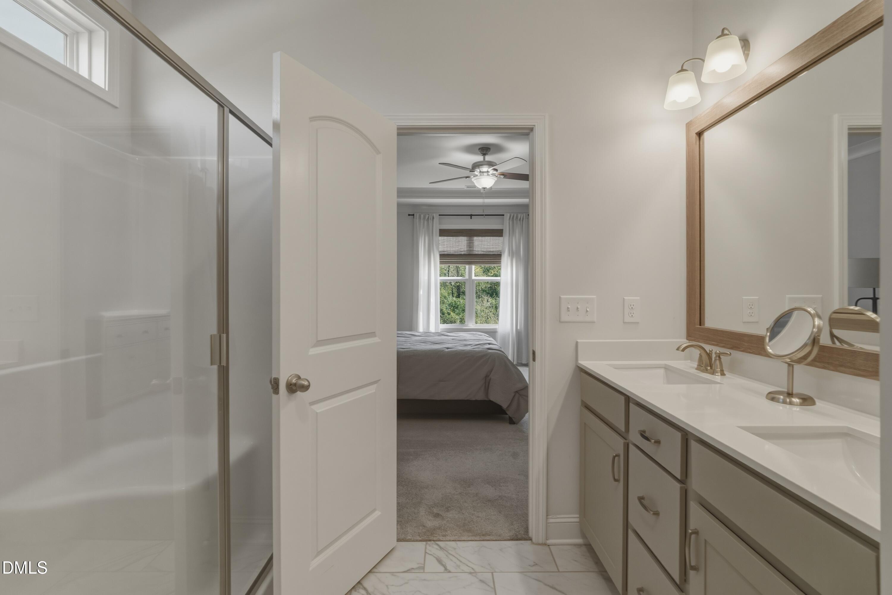 386 Howards Crossing Drive Wendell, NC 27591 - Photo 13 of 31 a bathroom with a sink a vanity and a mirror
