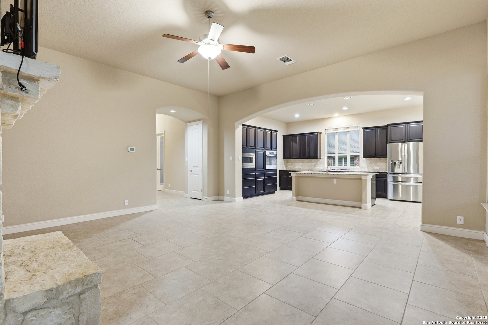 8234 Two Winds San Antonio, TX 78255 - Photo 12 of 37 a view of a kitchen with a sink and a refrigerator