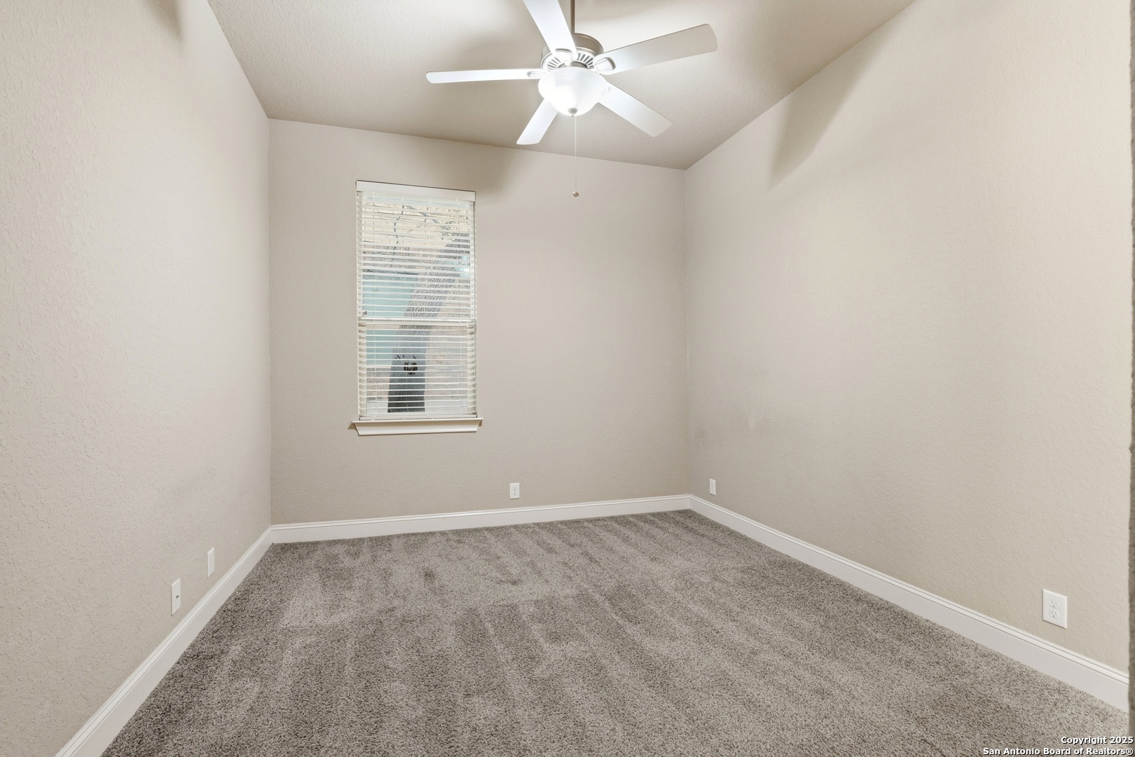 8234 Two Winds San Antonio, TX 78255 - Photo 22 of 37 an empty room with a window and ceiling fan