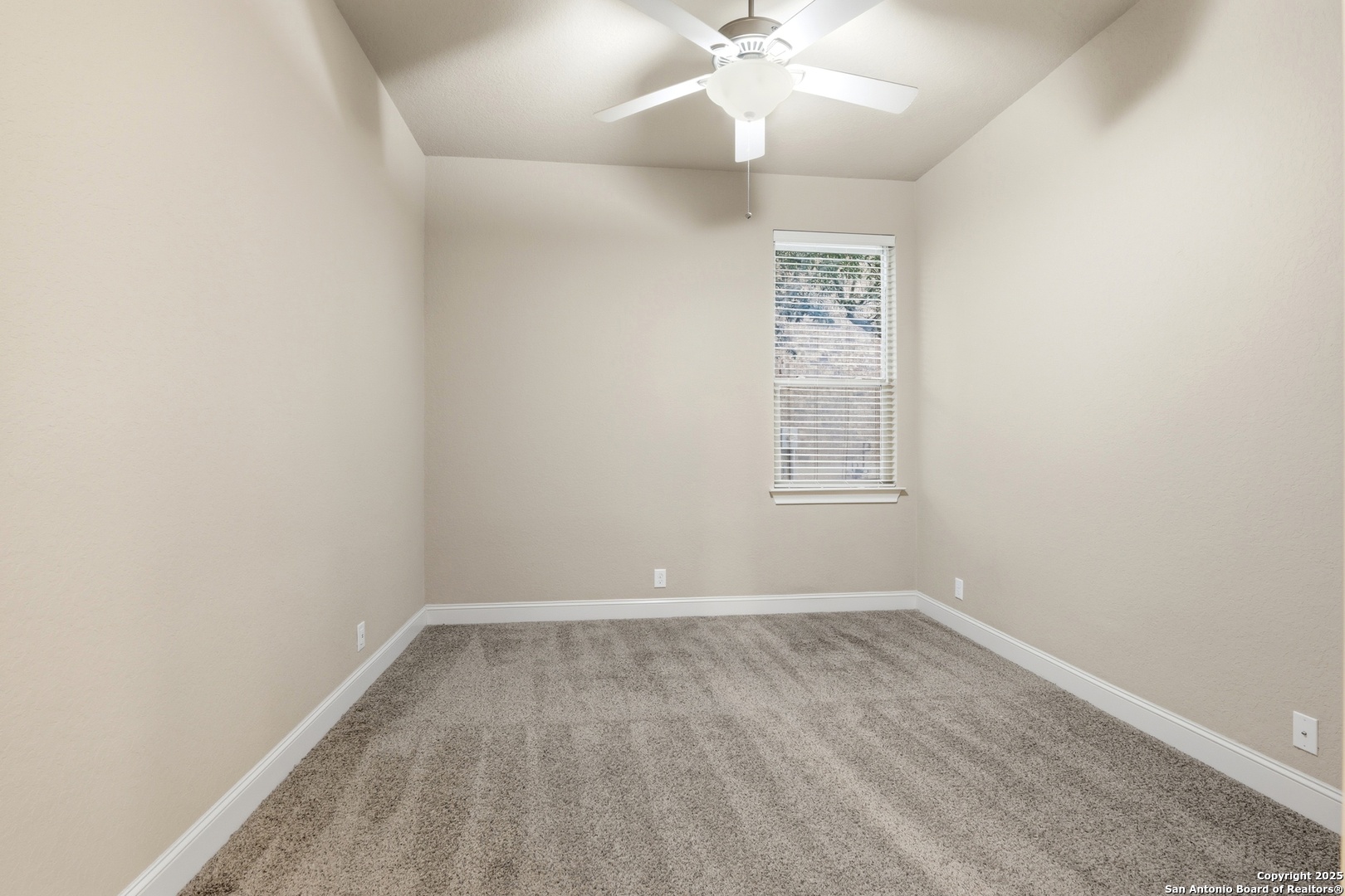 8234 Two Winds San Antonio, TX 78255 - Photo 25 of 37 an empty room with a window and a fan