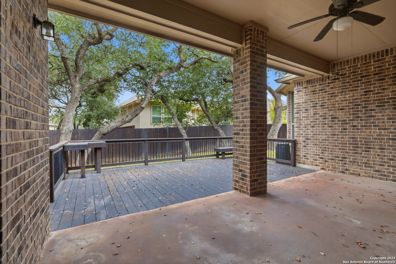 8234 Two Winds San Antonio, TX 78255 - Photo 27 of 37 a view of a balcony with floor to ceiling windows and wooden fence
