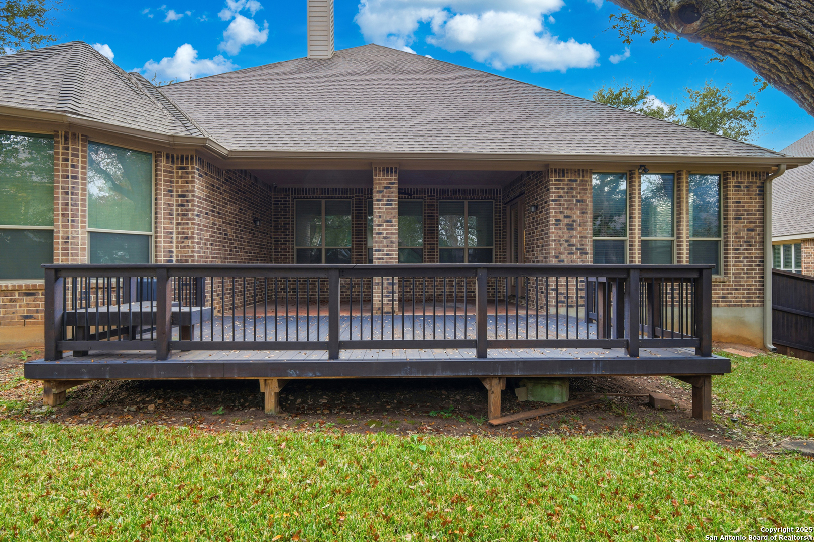 8234 Two Winds San Antonio, TX 78255 - Photo 29 of 37 a view of a house with wooden deck and a yard