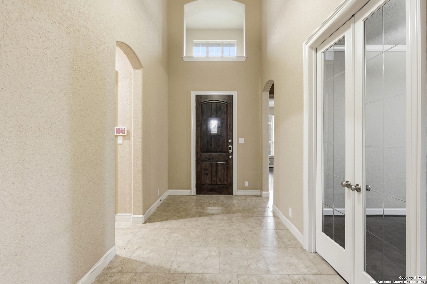 8234 Two Winds San Antonio, TX 78255 - Photo 6 of 37 a view of a hallway with wooden floor and a bathroom