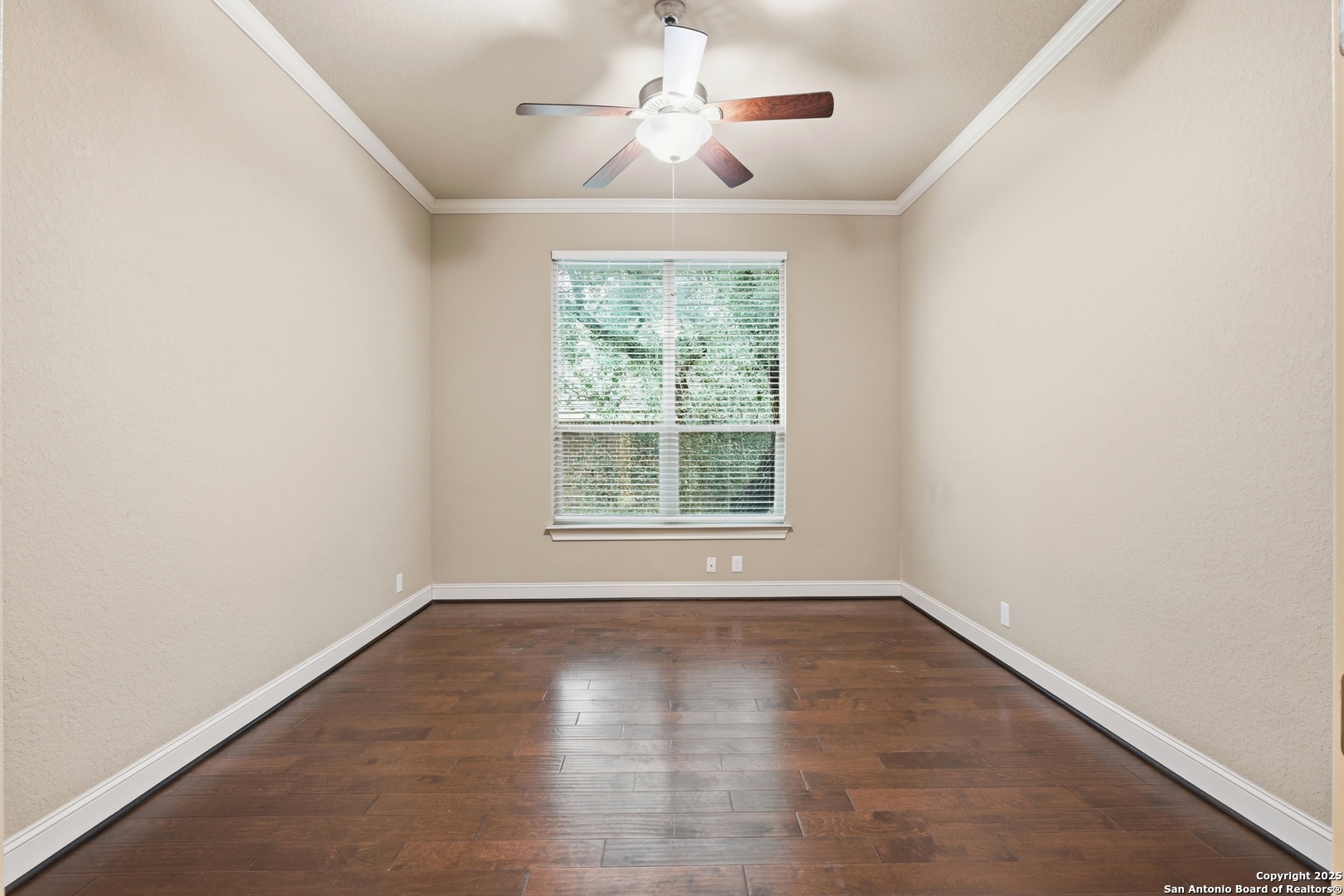 8234 Two Winds San Antonio, TX 78255 - Photo 9 of 37 a view of empty room with wooden floor and fan