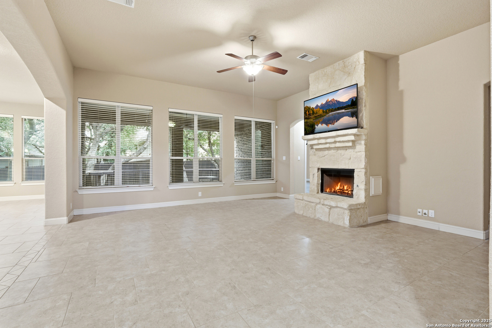 8234 Two Winds San Antonio, TX 78255 - Photo 10 of 37 a view of an empty room with window and fireplace