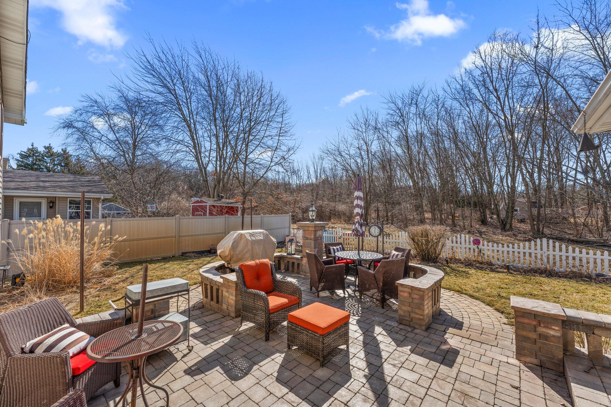 6881 West 86th Court Crown Point, IN 46307 - Photo 23 of 28 a view of a patio with table and chairs and potted plants