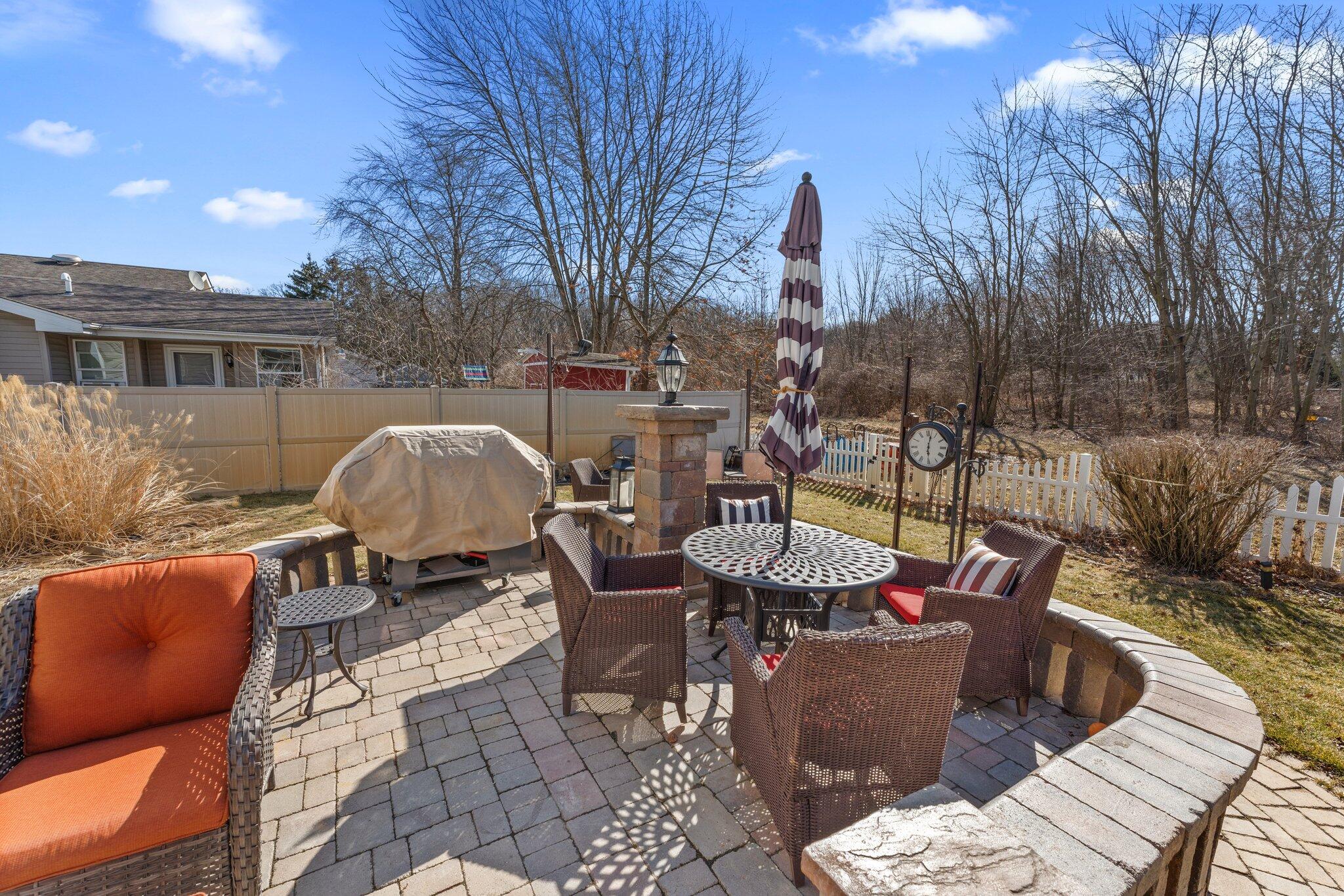 6881 West 86th Court Crown Point, IN 46307 - Photo 25 of 28 a view of a patio with couches table and chairs and potted plants
