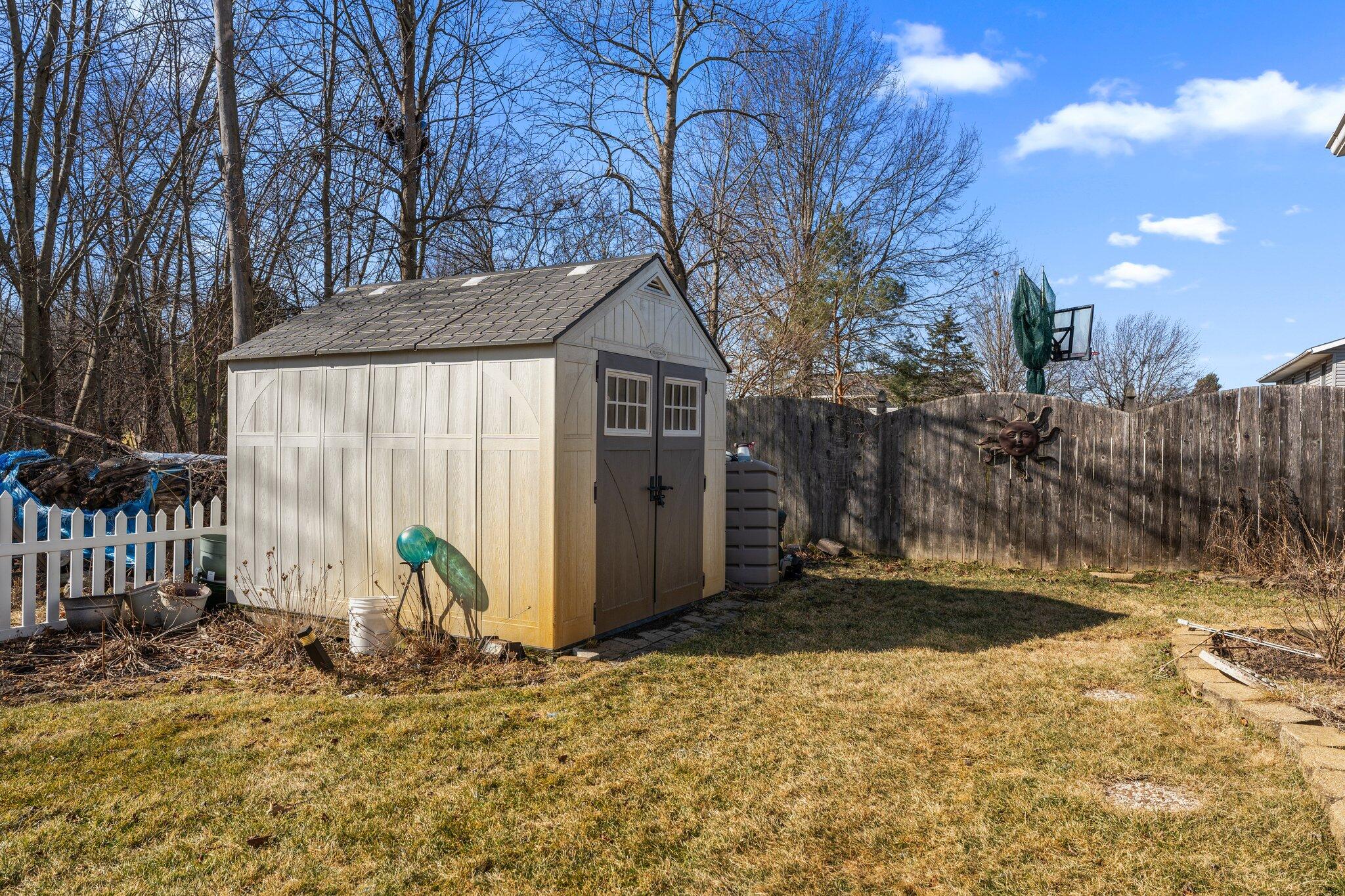 6881 West 86th Court Crown Point, IN 46307 - Photo 28 of 28 a view of a backyard with large tree