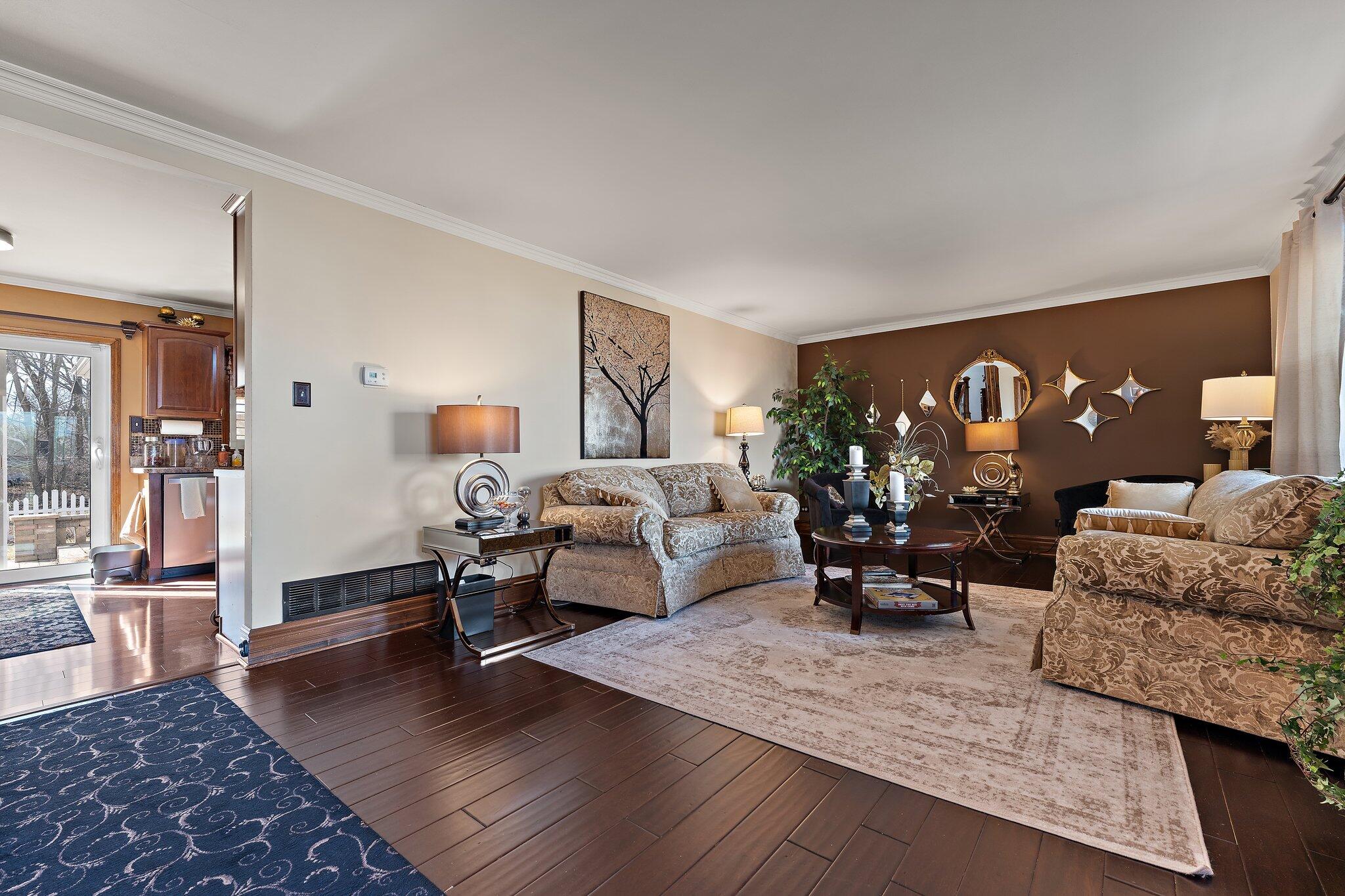 6881 West 86th Court Crown Point, IN 46307 - Photo 5 of 28 a living room with furniture and wooden floor