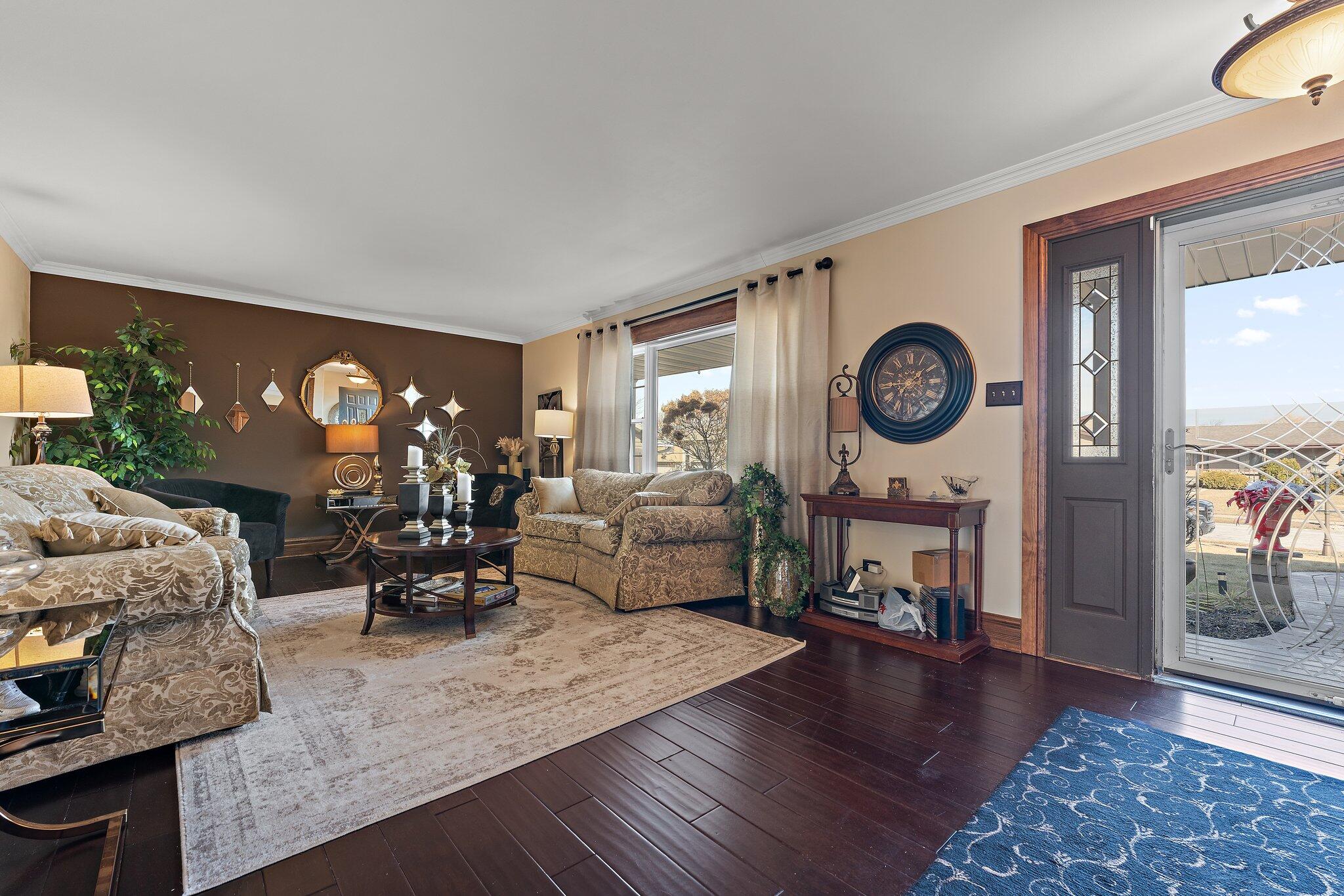6881 West 86th Court Crown Point, IN 46307 - Photo 6 of 28 a living room with furniture and a fireplace