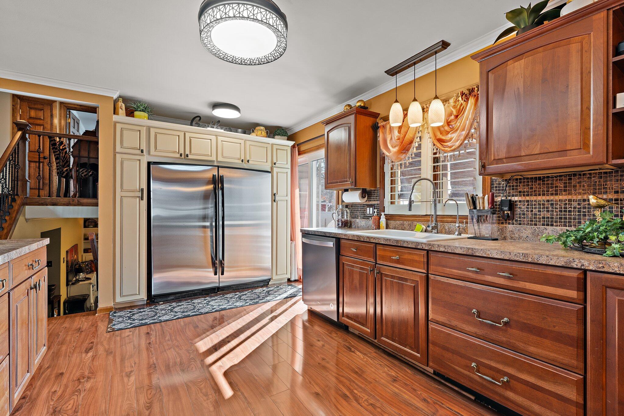 6881 West 86th Court Crown Point, IN 46307 - Photo 10 of 28 a kitchen with stainless steel appliances granite countertop a refrigerator and cabinets