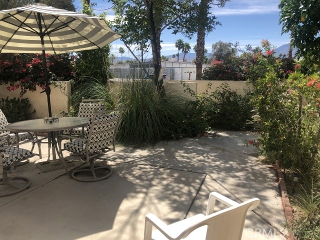 200 East Racquet Club Road, Unit 19 Palm Springs, CA 92262 - Photo 14 of 21 a view of outdoor space yard and patio