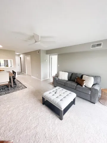 a living room with furniture and a couch