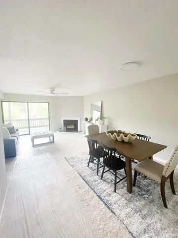a dining room with a table and chairs