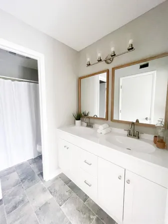 a white toilet sitting next to a shower curtain