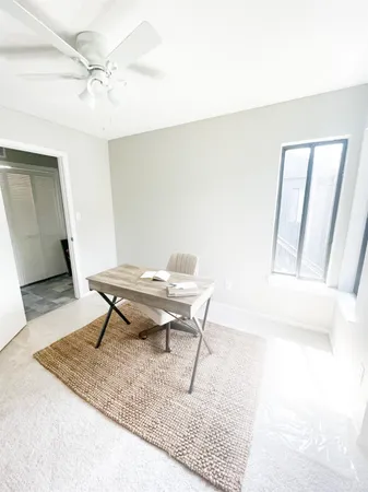 a workspace with furniture and bathroom