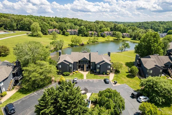 a view of a house with yard and sitting area