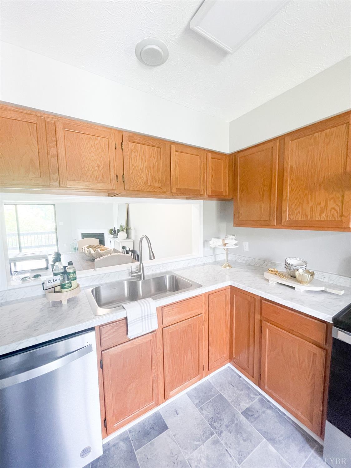 2222 Deer Run Forest, VA 24551 - Photo 5 of 44 a kitchen with a sink stove and cabinets