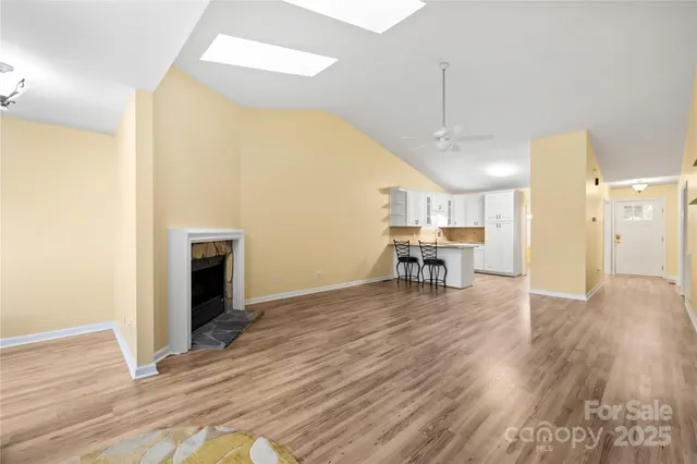 a view of a livingroom with furniture and wooden floor
