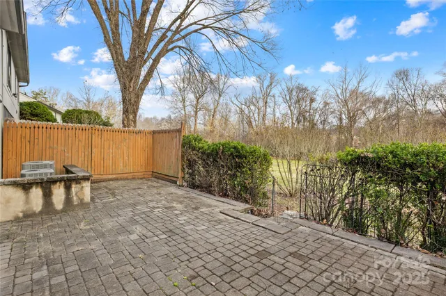 a view of a backyard with sitting area