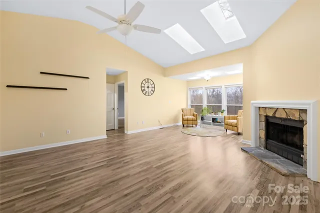 a view of a livingroom with furniture and a fireplace