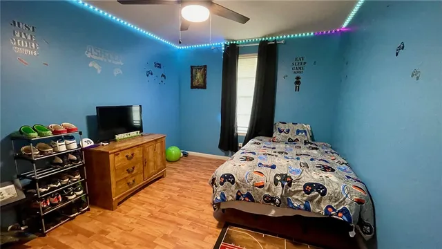 a bathroom with a toilet and a shower curtain