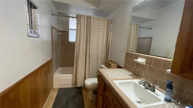 a bed room with a bed and a window