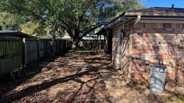a backyard of a house with lots of green space