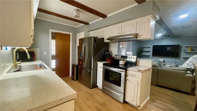 a view of a porch with furniture and a yard