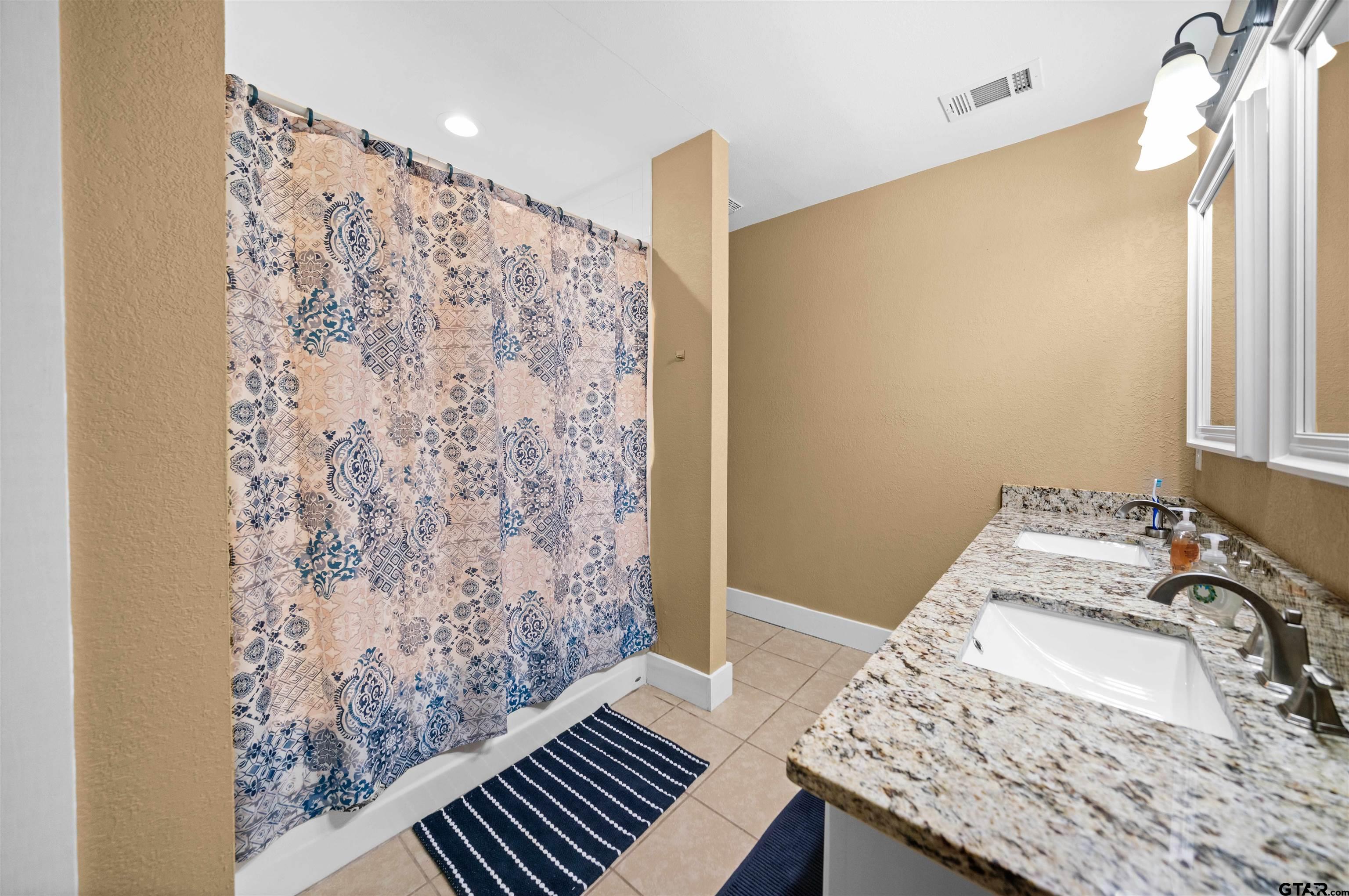 8781 Farm To Market 59 Athens, TX 75751 - Photo 20 of 37 a bedroom with a bed and a window