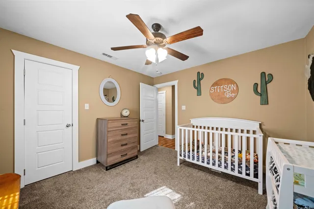 a bed room with furniture and window