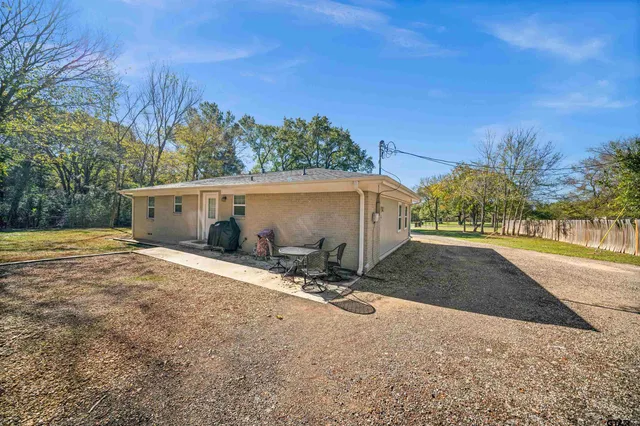 a white couch sitting next to a window