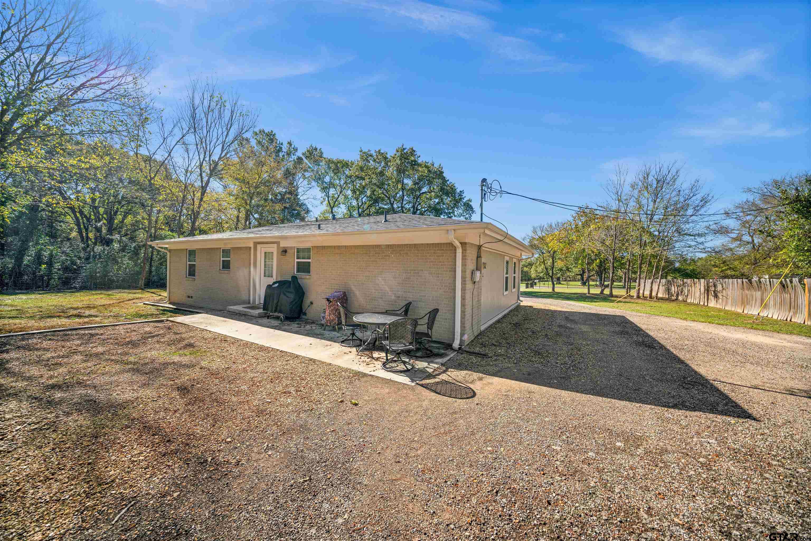 8781 Farm To Market 59 Athens, TX 75751 - Photo 8 of 37 a view of a house with backyard and trees