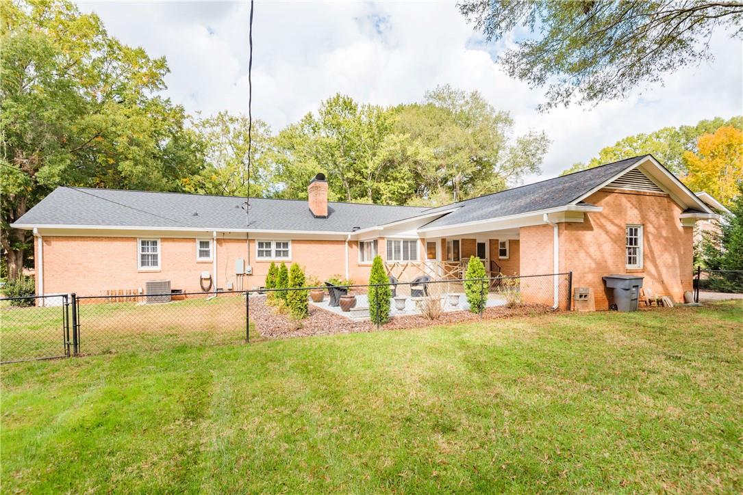 1001 Lansdowne Road Charlotte, NC 28270 - Photo 17 of 17 a view of a house with a big yard and sitting area