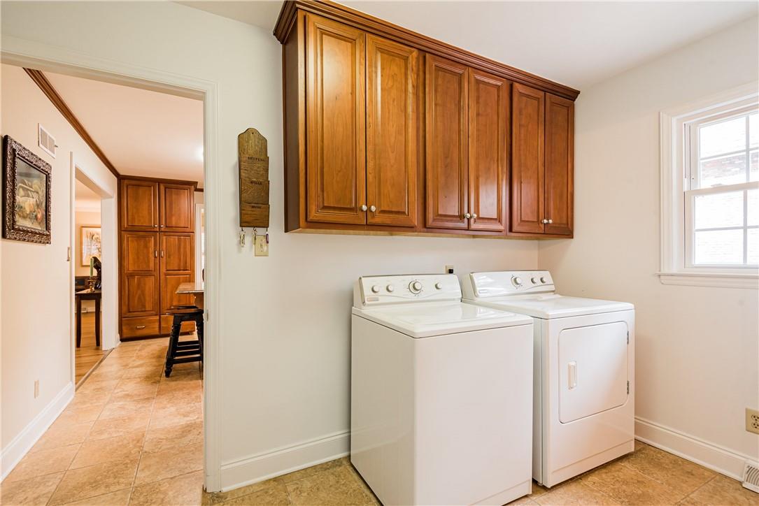 1001 Lansdowne Road Charlotte, NC 28270 - Photo 7 of 17 a view of storage and utility room with washer and dryer