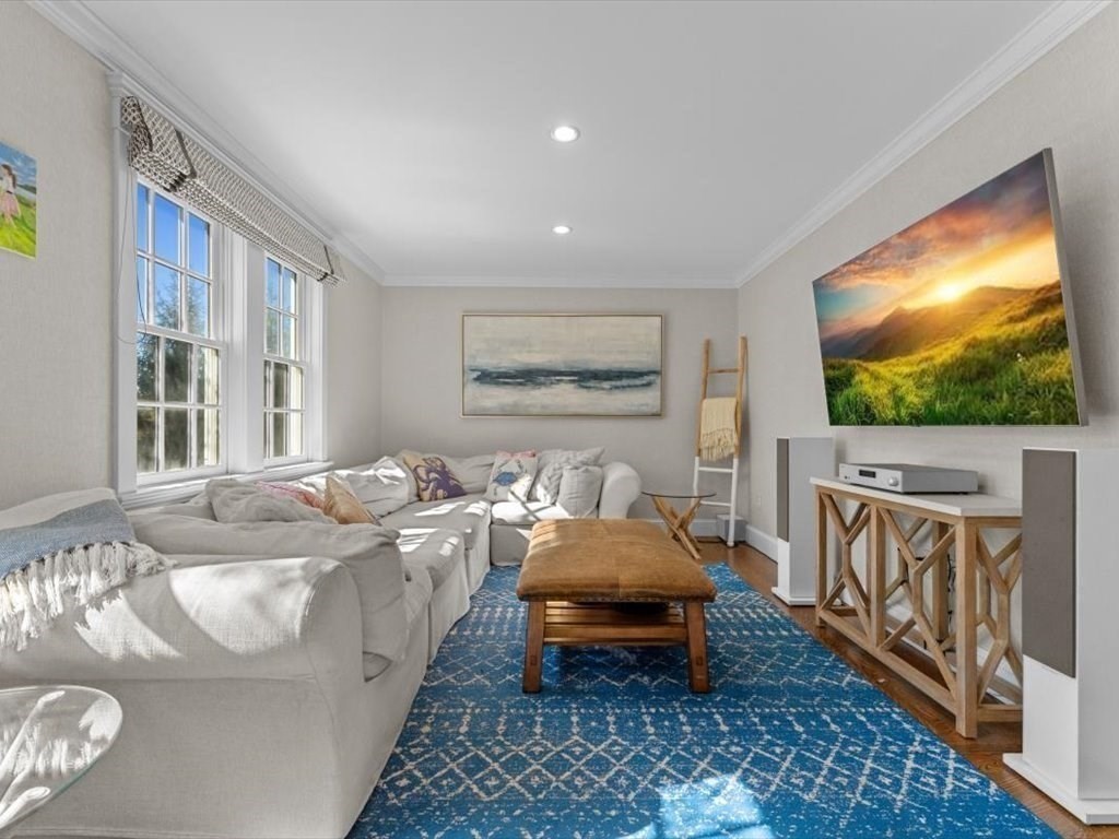 25 Forest Street Manchester, MA 01944 - Photo 13 of 34 a bed room with furniture and a flat screen tv