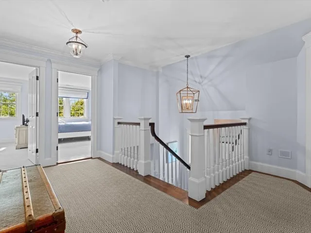 a view of a hallway with windows