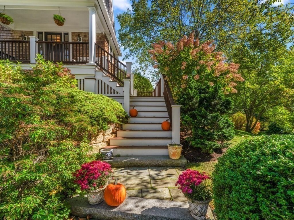 25 Forest Street Manchester, MA 01944 - Photo 2 of 34 a view of a house with a flower garden