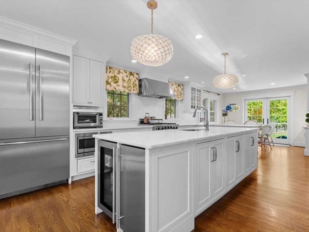 25 Forest Street Manchester, MA 01944 - Photo 10 of 34 a large kitchen with stainless steel appliances granite countertop a stove and a refrigerator