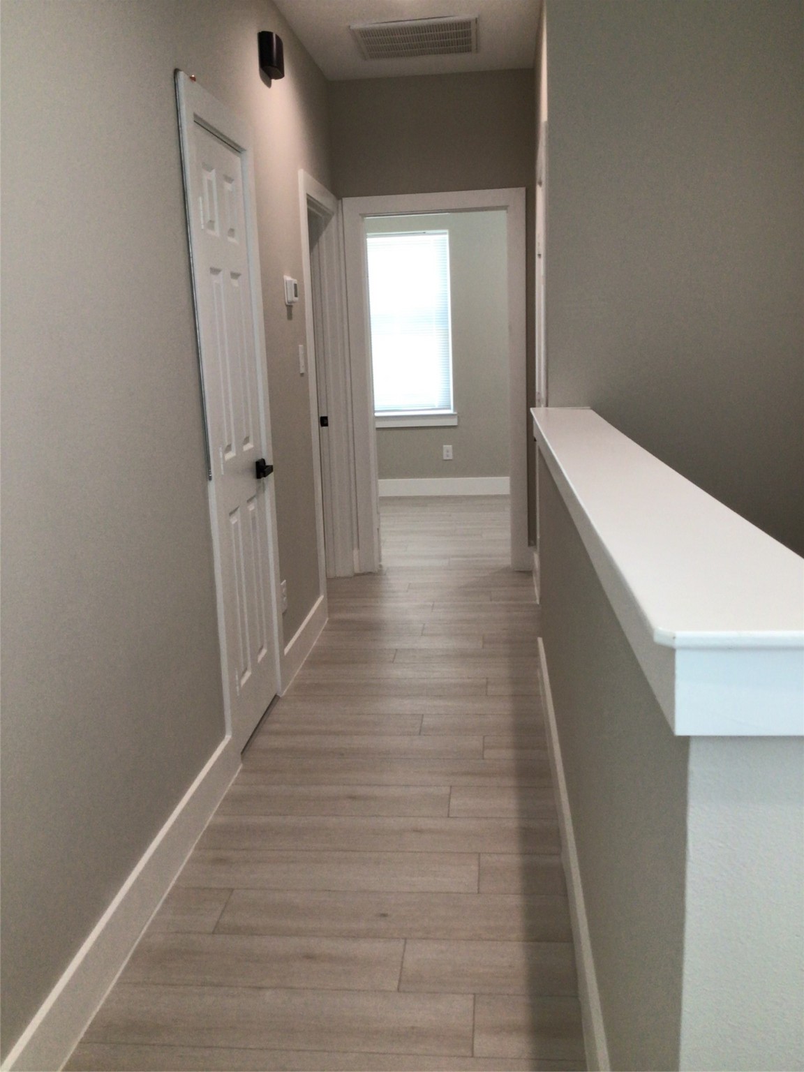 2109 Marnel Road, Unit B Houston, TX 77055 - Photo 25 of 46 a view of a hallway with wooden floor and staircase