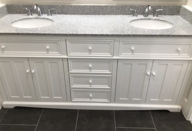 a bathroom with a glass shower door