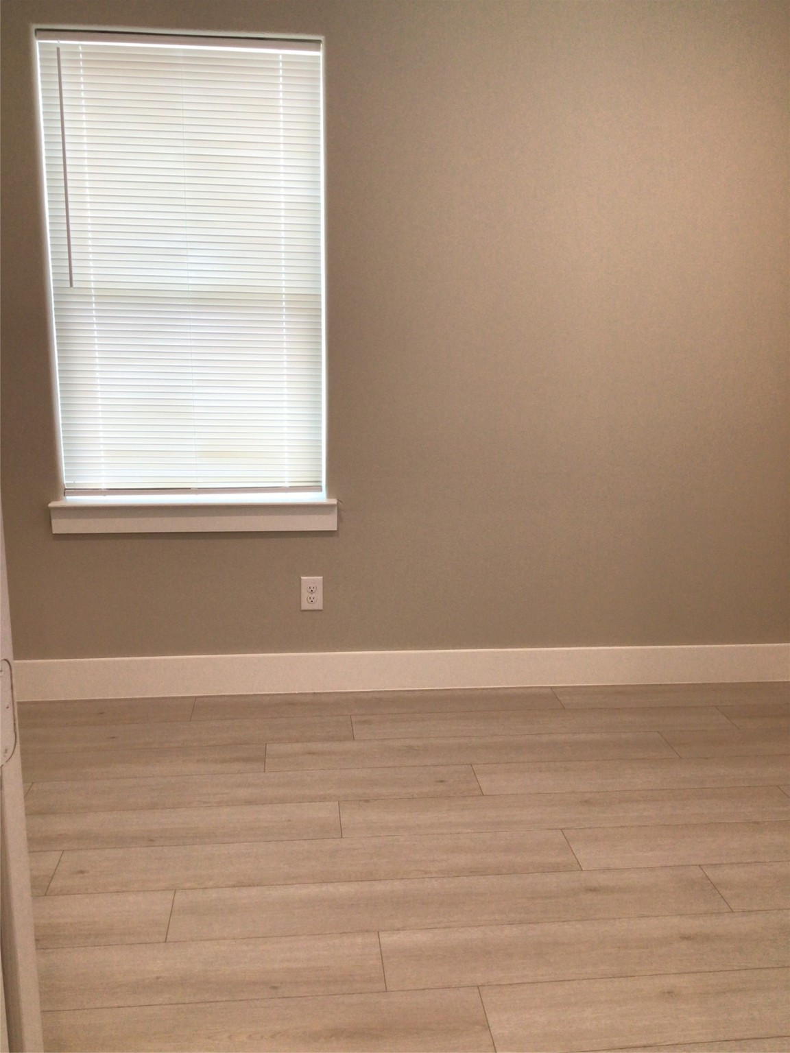 2109 Marnel Road, Unit B Houston, TX 77055 - Photo 38 of 46 a view of an empty room with wooden floor and a window