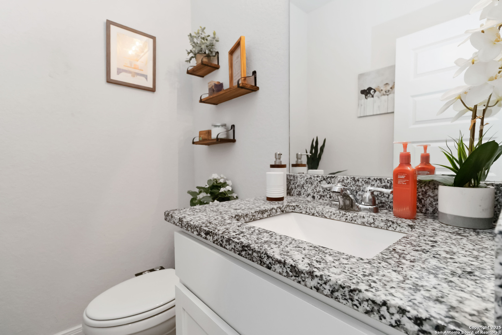 3335 Iron Canyon Bulverde, TX 78163 - Photo 13 of 17 a bathroom with a granite countertop sink a toilet and mirror