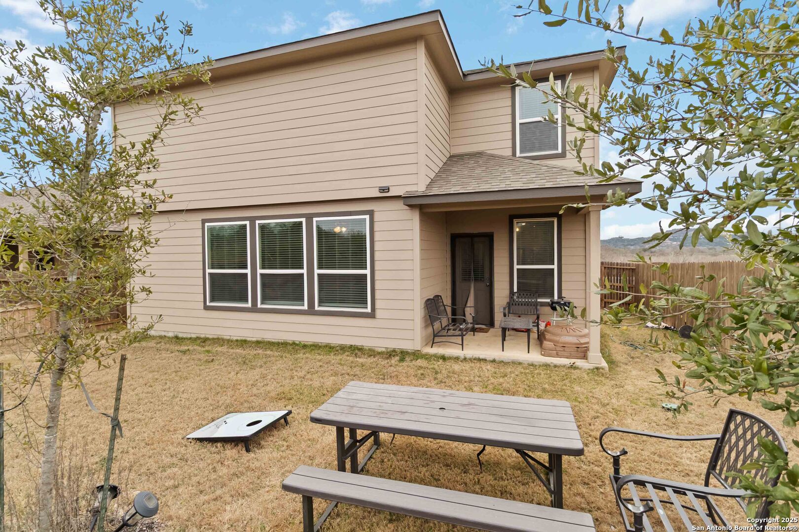 3335 Iron Canyon Bulverde, TX 78163 - Photo 14 of 17 a house view with a sitting space and garden